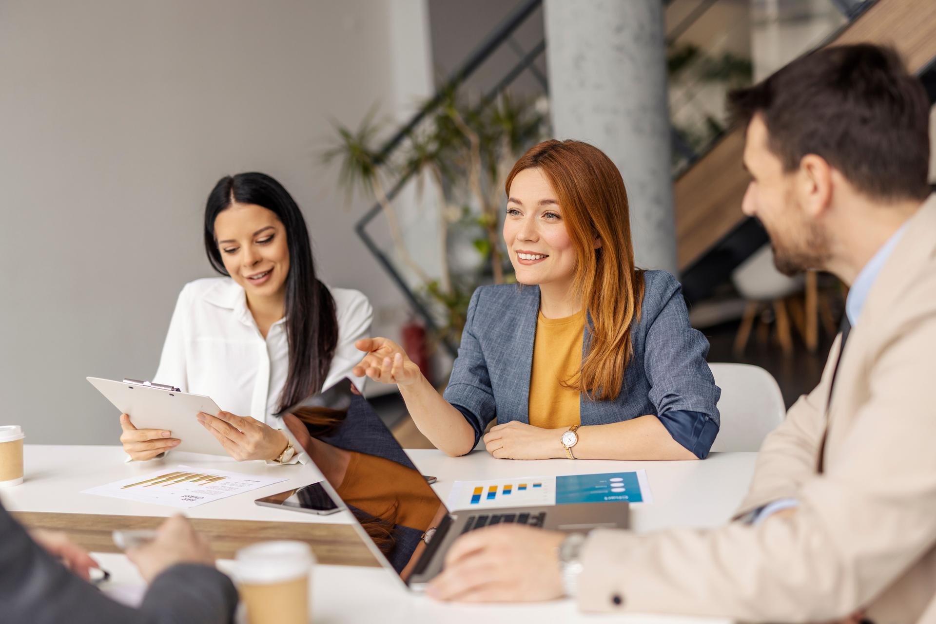 Leadership team having meeting and collaborating on a project at conference room.