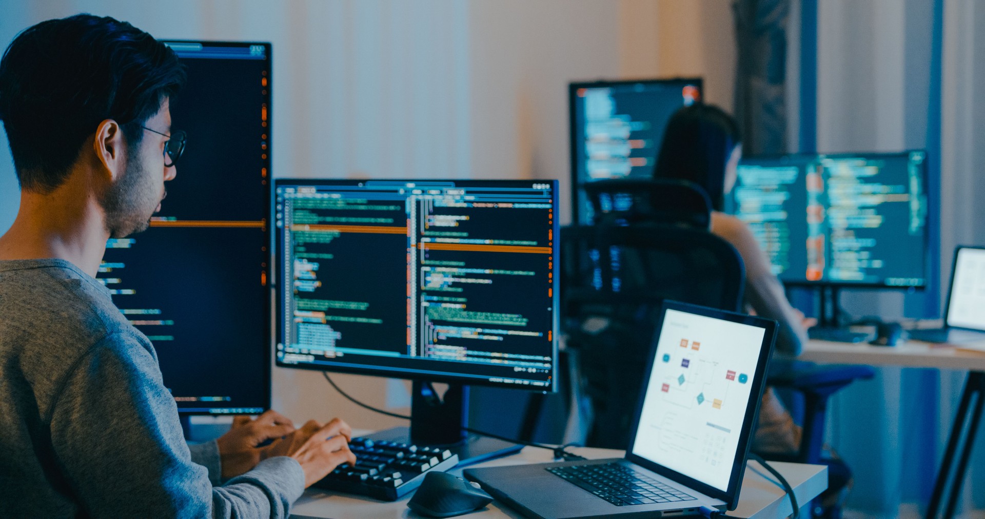 Group Adult Asia male, female freelance typing write prompt AI bot IT app smart program nomad, video game, terminal with coding language, designer, big data center on computer in night office.