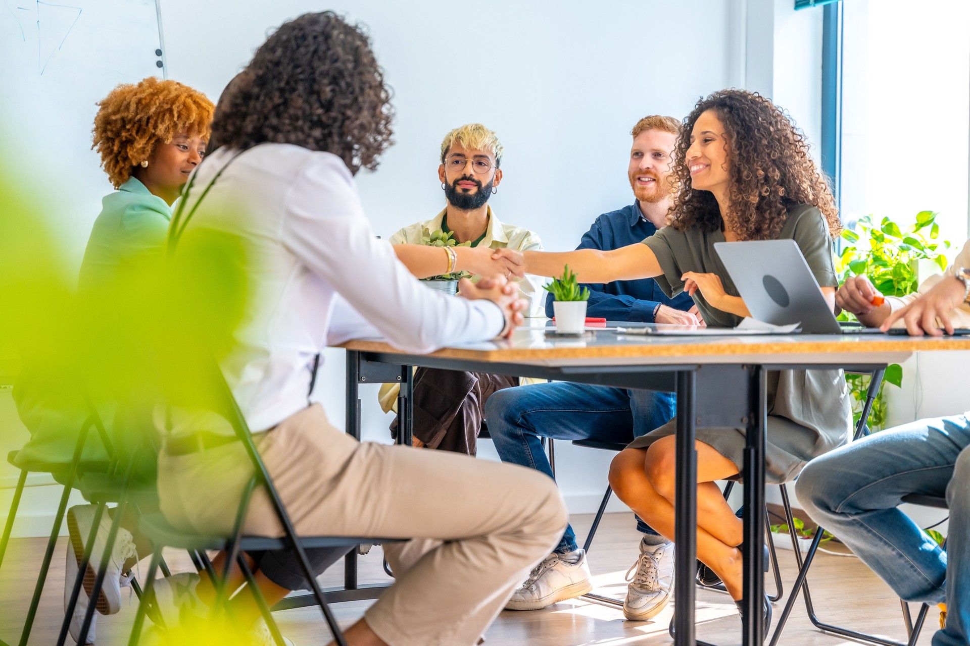 People greeting during a meeting in a coworking